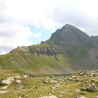   - A scenic picture of the peak from the path near Bombasel lakes
