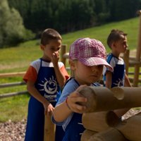 Children play on Cermis  - The lumberjack day on Cermis
